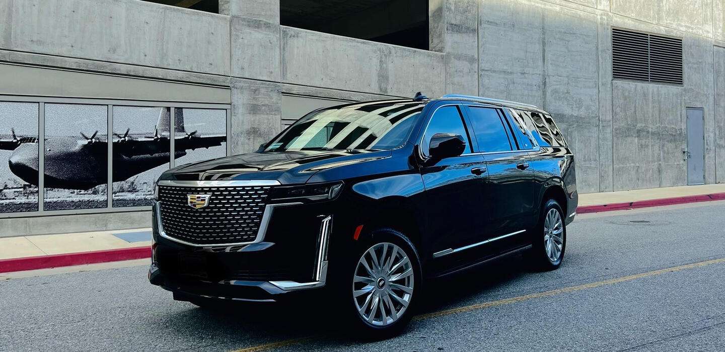 Black Escalade SUV at SNA Airport.